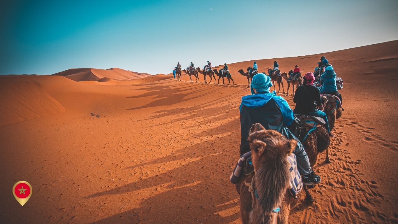 Group enjoying Agadir activities such as camel rides, Berber massage, and quad biking